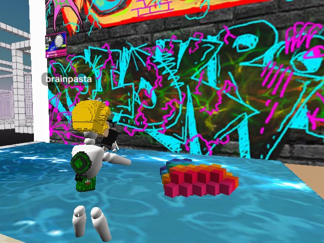 MetaMural Fest: Brainpasta getting down at Bitpixi's in front of Voidkross graffiti