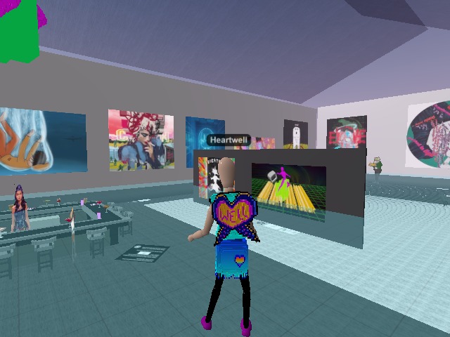 Sporting wearables ' Rainbow Heart Blue Fringe Skirt ' and ' Radiant Beings Wellness Shirt in Aqua ' at a cool exhibition FigureGlyphs!