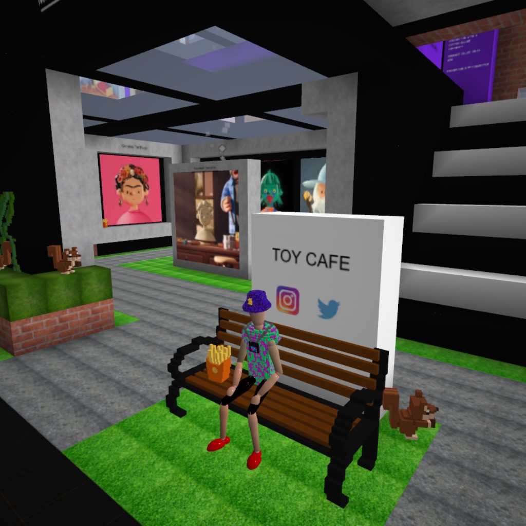Enjoying a bag of fries outside the Toy Cafe.